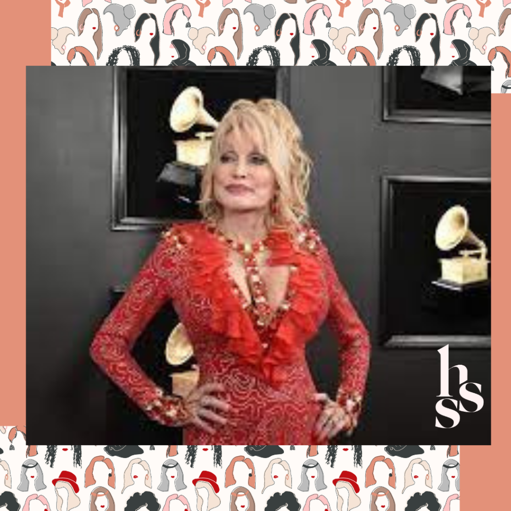 Dolly Parton in front of Grammy wall